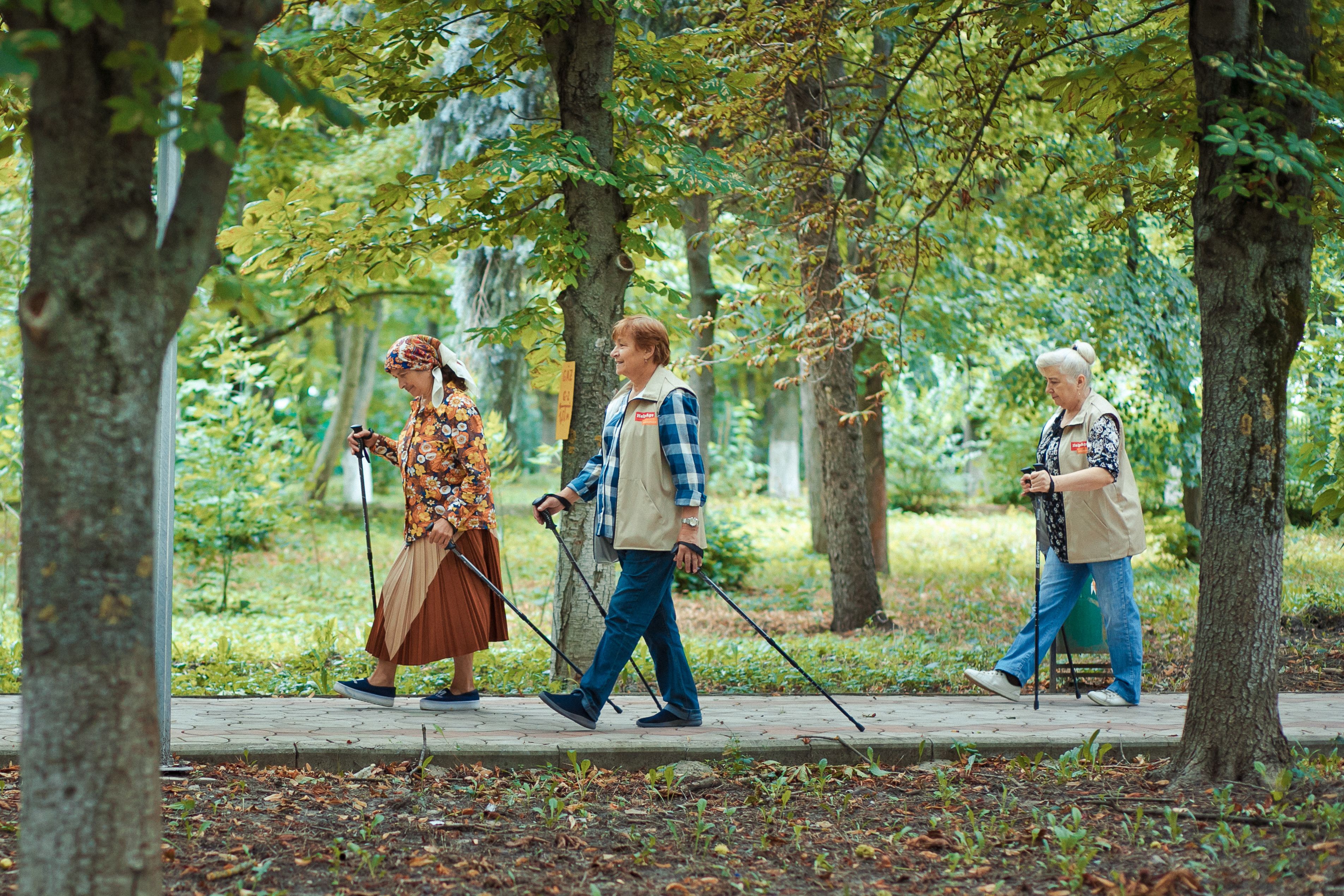 two people standing on top of hill