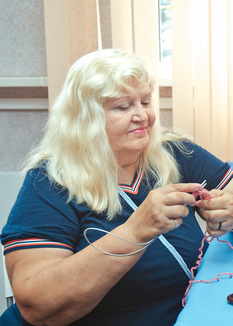 a woman with a necklace and headdress on