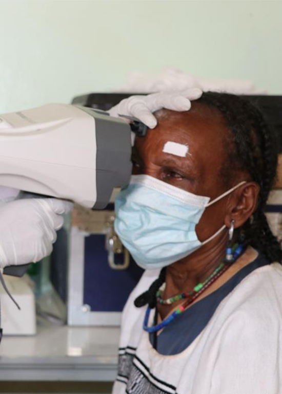 a woman with a necklace and headdress on
