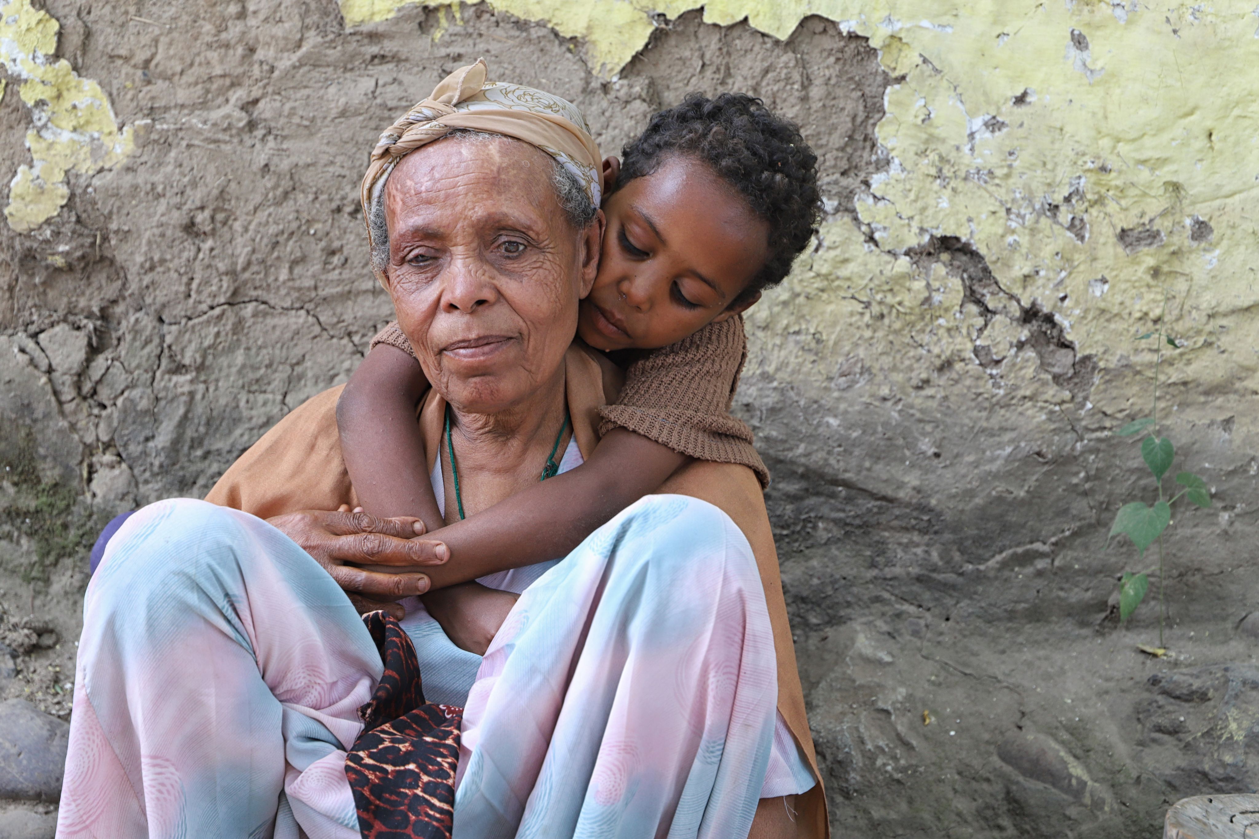a waterfall in the middle of a lush green valley