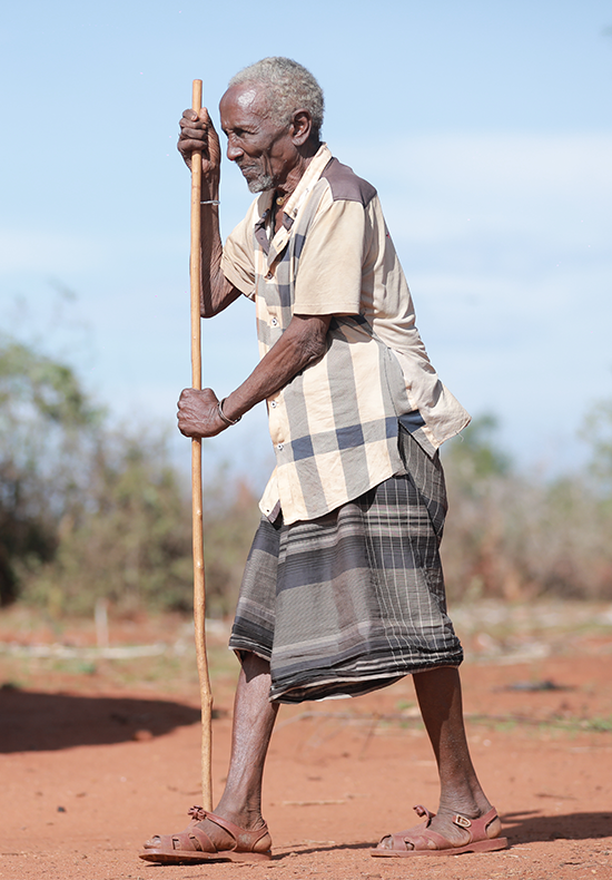 a woman with a necklace and headdress on