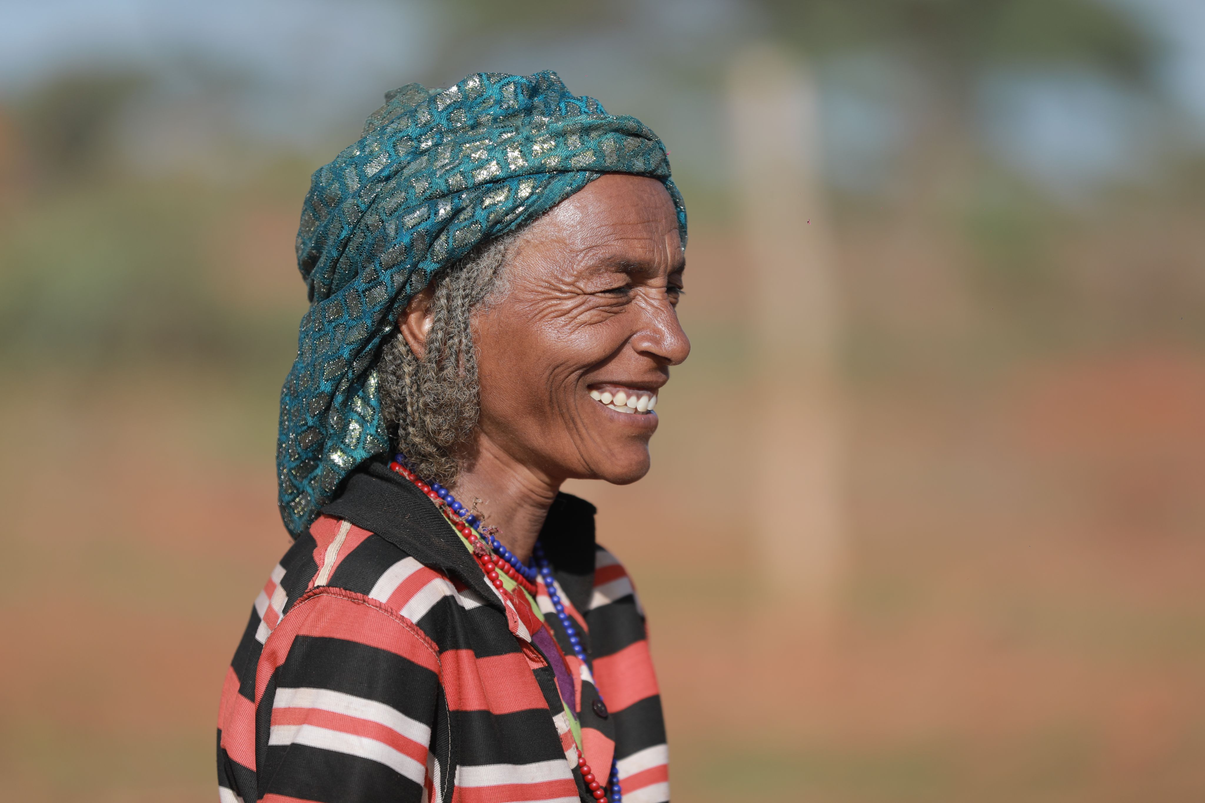 a waterfall in the middle of a lush green valley