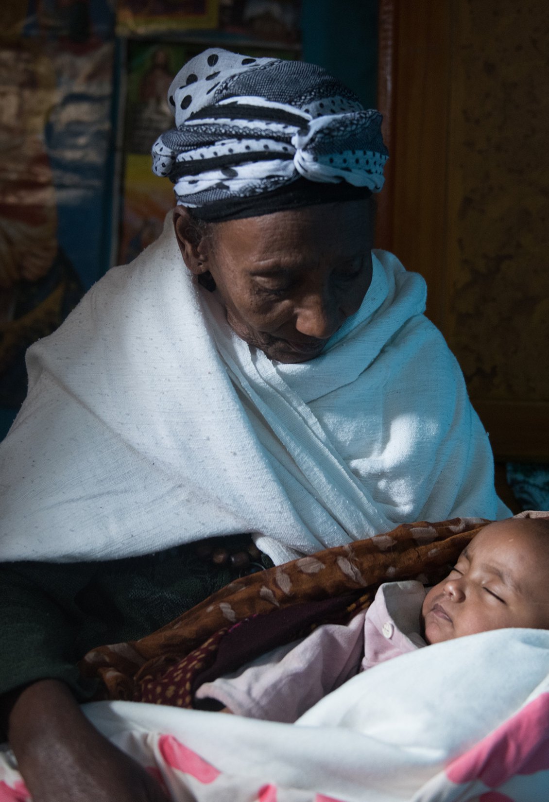 Older Ethiopian woman holding baby grandchild. (c) Michael Tsegaye, Age International